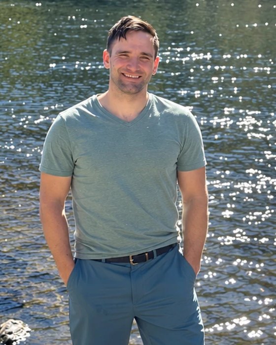 Alex Romano standing in a river